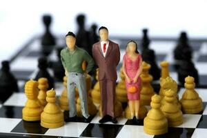 Businessman model on chess board. photo