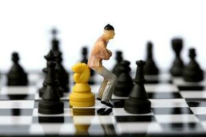 Businessman model on chess board. photo