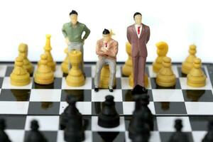 Businessman model on chess board. photo