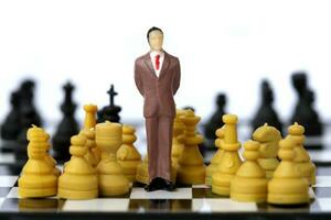 Businessman model on chess board. photo