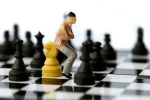 Businessman model on chess board. photo