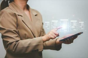 Business woman touching virtual monitor with document for online approve paperless quality assurance and ERP management concept. photo
