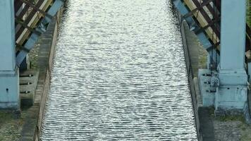 aerial view on dam lock sluice on river impetuous waterfall.  surface or expanse of water video