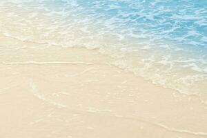 beautiful sandy beach and soft blue ocean wave. summer background concept photo
