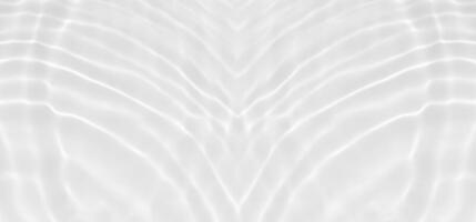 White water with ripples on the surface. Defocus blurred transparent white colored clear calm water surface texture with splashes and bubbles. Water waves with shining pattern texture background. photo