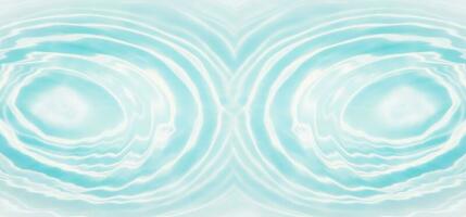 Blue water with ripples on the surface. Defocus blurred transparent blue colored clear calm water surface texture with splashes and bubbles. Water waves with shining pattern texture background. photo
