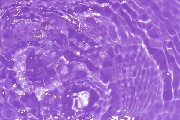 Purple water with ripples on the surface. Defocus blurred transparent pink  colored clear calm water surface texture with splashes and bubbles. Water  waves with shining pattern texture background. 24148685 Stock Photo at