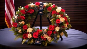 A patriotic wreath displayed on a table with an American flag backdrop. photo