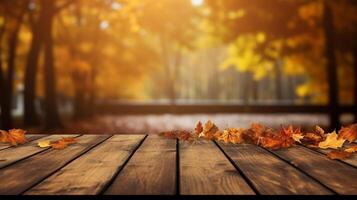 A wooden table topped with autumn leaves. photo