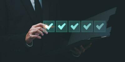 businessperson makes mark on the survey topic ,Auditing and evaluating the quality and efficiency of personnel ,Checklist with checkmarks and checkboxes ,answering questionnaires ,Online Assessment photo