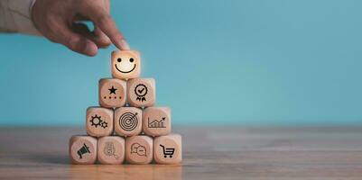 Consumer showing satisfaction rating concept with wooden blocks ,evaluation business success ,Services and Products and Customer Engagement ,Online ratings and reviews ,Quality Assessment photo