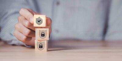 Businessman showing data access protection with padlock and shield icon ,safety technology ,Data protection and privacy with encryption ,Authentication to unlock the security system ,cyber security photo