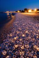 At night, the white beach is full of colorful glowing creatures and transparent glowing pebbles. photo