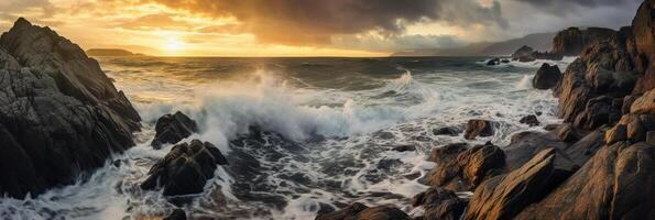The waves are crashing over the rocks at sunset. photo