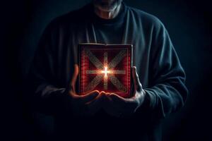 Man is holding and hugging the bible on his chest with atmosphere light. photo