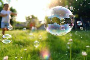 A close - up of big bubbles, blurred background of a child's legs wearing white clothes and running around on the lawn. photo