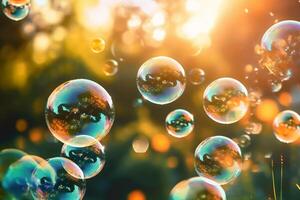 Soap bubbles against a blurred light natural summer background. photo