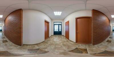 full seamless spherical hdri 360 panorama in interior of long narrow empty corridor room in modern apartments, office with many wooden doors and red brick walls in equirectangular projection photo