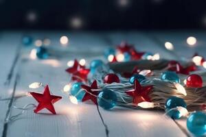 Christmas background with blue light luminous garlands and red stars on a white wooden background with copy space. photo