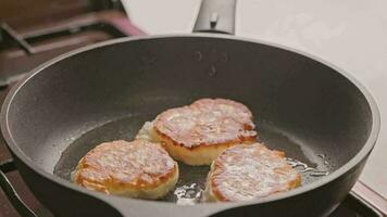 pancakes frying on skillet with vegetable oil video
