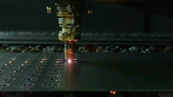 process of sheet metal laser cutting, close-up with selective focus video