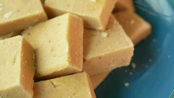 Close up of Indian sweets in a bowl on table video