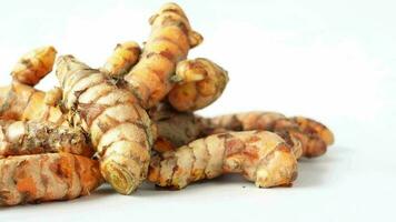 Detail shot of turmeric root in bowl on table video