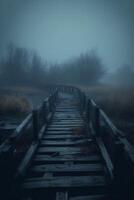 Old wooden bridge leading to nowhere in the fog, broken, gloomy dark blue, mysterious, loneliness. photo