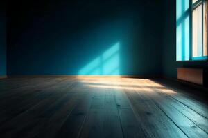 Blue empty wall and wooden floor with interesting light glare. Interior background for the presentation. photo