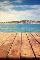 Wooden table blurred Croatian sea in Vodice background. photo