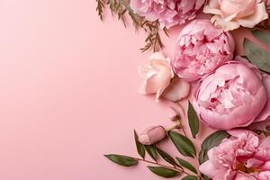 Peonies, roses on pink background with copy space. Abstract natural floral frame layout with text space. Romantic feminine composition. photo