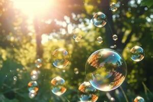 Soap bubbles against a blurred light natural summer background. photo