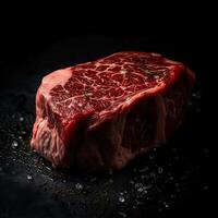 Fresh uncooked beef steak, black background. photo