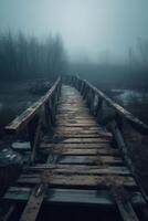 Old wooden bridge leading to nowhere in the fog, broken, gloomy dark blue, mysterious, loneliness. photo
