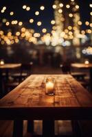 Image of wooden table in front of abstract blurred background of restaurant lights. photo