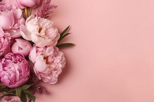 Peonies, roses on pink background with copy space. Abstract natural floral frame layout with text space. Romantic feminine composition. photo