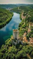 an aerial view of Skradin's historic center, with its winding streets and colorful buildings nestled among the lush greenery. photo