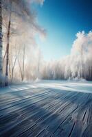 Winter Christmas scenic landscape with copy space. Wooden flooring, white trees in forest covered with snow, snowdrifts and snowfall against blue sky in sunny day photo