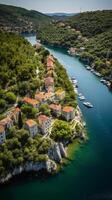 an aerial view of Skradin's historic center, with its winding streets and colorful buildings nestled among the lush greenery. photo