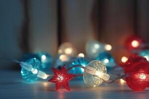 Christmas background with blue light luminous garlands and red stars on a white wooden background with copy space. photo