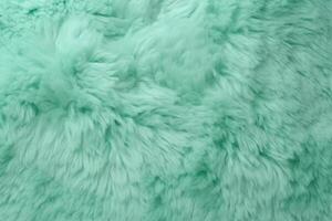 Very peri mint color sheep fur sheepskin rug background Wool texture. photo