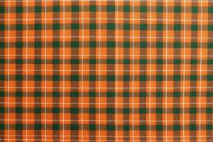 orange fabric textile pattern, plaid background, linen cotton. photo