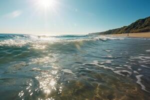 Summer landscape, nature of tropical with rays of sun light. Beautiful sun glare in wave of transparent blue water on beach against blue sky. photo