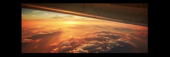 The view from the plane window to the sunset. Aerial view. photo