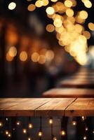 Image of wooden table in front of abstract blurred background of restaurant lights. photo