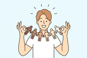 Smiling young man holding garland of diverse multiracial people. Happy guy show ethnicity and diversity. Racial equality concept. Vector illustration.