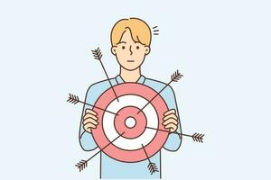 Young businessman with target in hands for goal achievement. Male employee or worker with arrows on aim. Achieve success concept. Vector illustration.