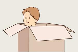 Frightened man hides in carton box and looks out to inspect area around. Frightened young guy with embarrassment hiding in cardboard package trying to avoid meeting offender or unpleasant person vector