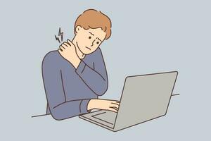 Tired young man sit on desk working on computer suffering from backache. Exhausted guy use laptop struggle with pain in sedentary position. Vector illustration.