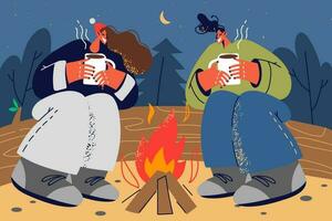 Happy couple sitting near campfire in forest at night drinking hot tea. Smiling man and woman relax together near fire in wood. Vector illustration.